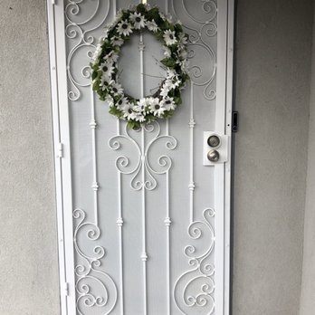 ADE Wrought Iron - Custom security door done in Matte white - Fences & Gates Near Me