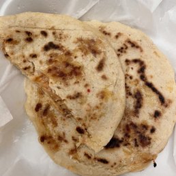 two tortillas in a styrofoam container