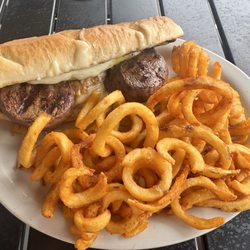 Wellington Pub - Local Legend - Two 4 ounce tenderloins, stuffed banana pepper, mozzarella cheese served on a garlic hoagie