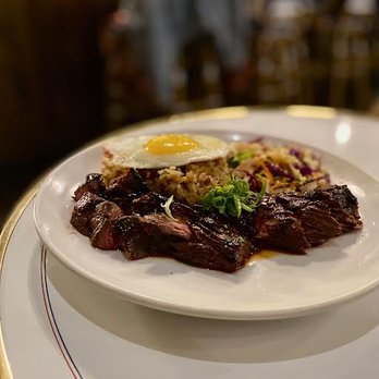 Fete - Bavette, grass-fed cut with Tutu's kochujang sauce, ginger scallion fried rice, sunny side up egg and Asian pear slaw - New American Near Me - Honolulu, Hawaii