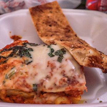 Pizza Kitchen - a lasagna with cheese and spinach - Pizza Near Me - Indio, California