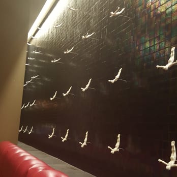 Rosa Mexicano - A water wall with little men on the wall as if they are diving - Mexican Near Me - Boston, Massachusetts Rosa Mexicano - A water wall with little men on the wall as if they are diving - Mexican Near Me - Boston, Massachusetts