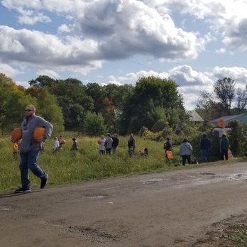 Collegeville Orchards - a group of people walking down a dirt road - Fruits & Veggies Near Me - Saint Joseph, Minnesota Collegeville Orchards - a group of people walking down a dirt road - Fruits & Veggies Near Me - Saint Joseph, Minnesota