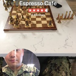 Bellissimo Espresso Cafe - Kicking butt on one of the few chess boards spread around the cafe! Lol :D