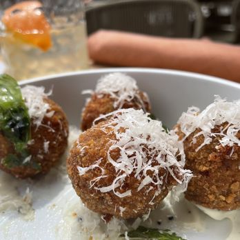 Riva Terrace - a plate of meatballs covered in cheese - Italian Near Me - Minneapolis, Minnesota Riva Terrace - a plate of meatballs covered in cheese - Italian Near Me - Minneapolis, Minnesota