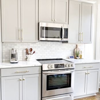 Nouveau Construction - a kitchen with stainless steel appliances - General Contractors Near Me Nouveau Construction - a kitchen with stainless steel appliances - General Contractors Near Me