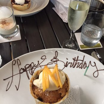 Backstreet Cafe - Houston Restaurant Weeks dessert: Peach Cobbler with a sweet birthday wish paired with dessert bubbles. - New American Near Me - Houston, Texas