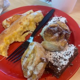 a plate of food with a fork and a cup of coffee