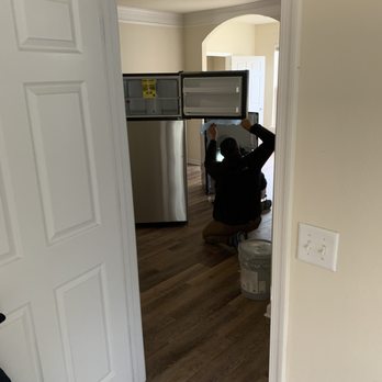Hideaway at Greenbrier - Move in Day.  Appliances in the middle of living room. - Apartments Near Me - Chesapeake, Virginia