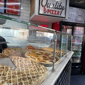 Quality Pizza - a variety of pizzas in a display case - Pizza Near Me - Hoboken, New Jersey