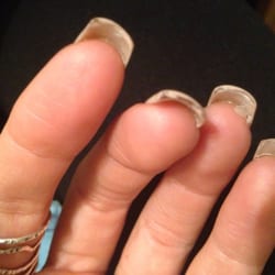 Fashion Nails & Hair - Glue stuck under nails and tips not completely painted.