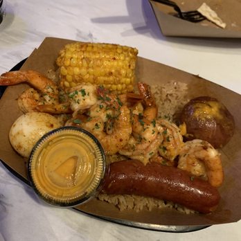 RocknCrabSeafood - Rock'n pack with boiled shrimp, sausage, corn, potato and boiled egg over rice. - Seafood Near Me - Beaumont, Texas