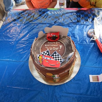 Luscious Organic Desserts - The finished Cars themed cake (no fondant). Applique cars all around. - Bakeries Near Me Luscious Organic Desserts - The finished Cars themed cake (no fondant). Applique cars all around. - Bakeries Near Me