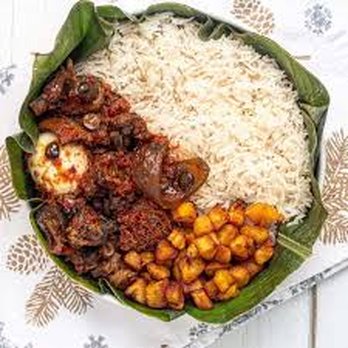Oyato Cuisine - a plate of rice, beans, and meat - African Near Me - Niagra Falls, Ontario Oyato Cuisine - a plate of rice, beans, and meat - African Near Me - Niagra Falls, Ontario