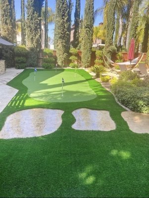Putting Greens - An artificial putting green is a synthetic surface designed to replicate the look and feel of a natural grass putting green. These greens can be made from various materials, including synthetic turf, rubber, and plastic. They are often used in golf practice facilities, backyards, and indoor putting greens. Some benefits of artificial putting green include low maintenance, durability, and the ability to customize the green’s speed and contours.
They can also be used in areas where natural grass is not practical, such as indoor locations or areas with limited sunlight. Overall, artificial putting greens are a popular choice for golfers looking to improve their putting skills and those who want a low-maintenance alternative to natural green grass.
At So Cal Artificial Turf, we offer a variety of putting greens that are perfect for your next golf outing in Irvine, CA. With various putting greens to choose from, we are confident that we can find the perfect green for you. Putting Greens - An artificial putting green is a synthetic surface designed to replicate the look and feel of a natural grass putting green. These greens can be made from various materials, including synthetic turf, rubber, and plastic. They are often used in golf practice facilities, backyards, and indoor putting greens. Some benefits of artificial putting green include low maintenance, durability, and the ability to customize the green’s speed and contours.
They can also be used in areas where natural grass is not practical, such as indoor locations or areas with limited sunlight. Overall, artificial putting greens are a popular choice for golfers looking to improve their putting skills and those who want a low-maintenance alternative to natural green grass.
At So Cal Artificial Turf, we offer a variety of putting greens that are perfect for your next golf outing in Irvine, CA. With various putting greens to choose from, we are confident that we can find the perfect green for you.