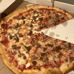 Ollie's Slice Shop - Caramelized Union and sausage. Half vegan cheese half regular. $37