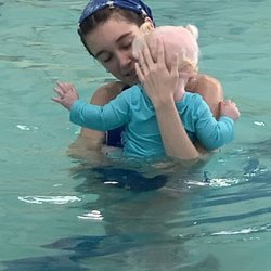 Miss Riley comforting Cali as she is nervous with this whole pool idea while sleepy