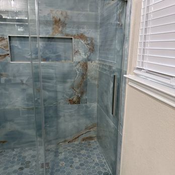 Extreme Renovations - a shower with a glass door - Painters Near Me Extreme Renovations - a shower with a glass door - Painters Near Me