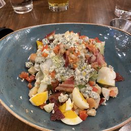 Blue Cheese Iceberg Wedge Salad with extra cost Blue Cheese added. Blue Cheese Iceberg Wedge Salad with extra cost Blue Cheese added.