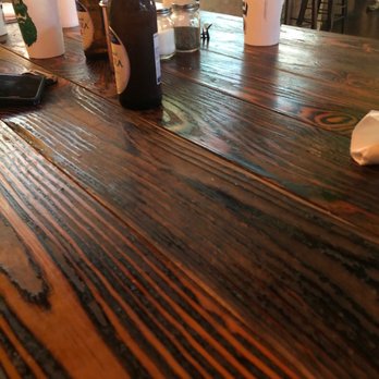 Bradshaw Social House - a wooden table with drinks on it - American Near Me - Charlotte, North Carolina Bradshaw Social House - a wooden table with drinks on it - American Near Me - Charlotte, North Carolina