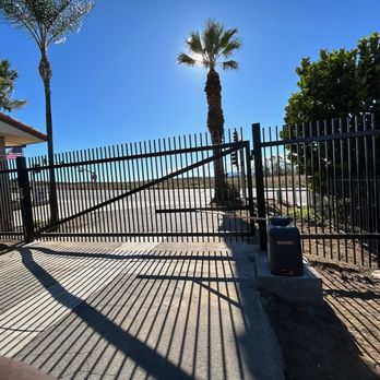 Refiners Fence - Wrought iron gate with motor - Fences & Gates Near Me Refiners Fence - Wrought iron gate with motor - Fences & Gates Near Me