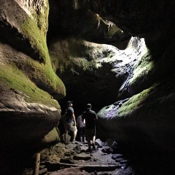 Ape Cave - Half way through the lava tube. Some light! - Hiking Near Me Ape Cave - Half way through the lava tube. Some light! - Hiking Near Me