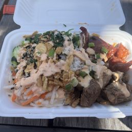 Adobo, tocino, cucumber, fried onions and garlic, spinach, white rice, spicy mayo