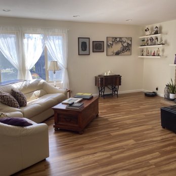 DRV REMODELING & CONSTRUCTION - Living room: removed existing carpeting and installed hardwood flooring and baseboards - General Contractors Near Me