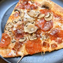 Cali-Forno Pizzeria - Pizza slice. Pepperoni, mushrooms, bacon.