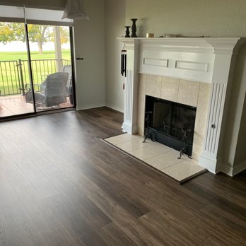 PK Floors Plus - a fireplace in a living room - Flooring Near Me - Rockwall, Texas