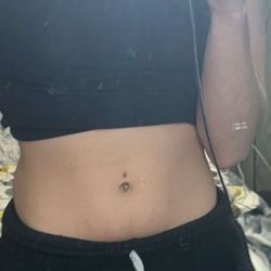 The Tattoo Shoppe - Belly button piercing.