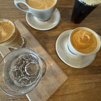 PT's Coffee - Crossroads - Left: Cortado Middle top: spooky season latte (smoked pumpkin spice) Right top: Nitro cold brew Right lower: cappuccino - Coffee & Tea Near Me - Kansas City, Missouri PT's Coffee - Crossroads - Left: Cortado Middle top: spooky season latte (smoked pumpkin spice) Right top: Nitro cold brew Right lower: cappuccino - Coffee & Tea Near Me - Kansas City, Missouri