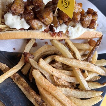 La Salchipaperia D.C. - El Criollo hotdog - butter buns, sausage, caramelized onions, bacon, cream cheese, and sweet plantains. - Burgers Near Me - Oakland Park, Florida