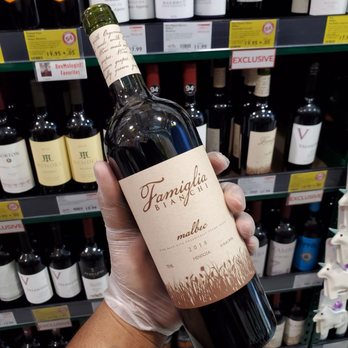 BevMo! - a hand holding a bottle of wine - Beer, Wine & Spirits Near Me - Burbank, California BevMo! - a hand holding a bottle of wine - Beer, Wine & Spirits Near Me - Burbank, California