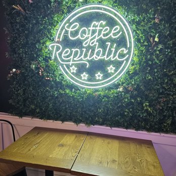 Coffee Republic - Metro Center - a table and a neon sign - Coffee & Tea Near Me - Washington, DC, District of Columbia