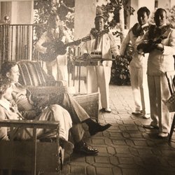 The Royal Hawaiian History Tour - Amelia Earhart and her husband, George P. Putnam being serenaded by Hawaiian performers