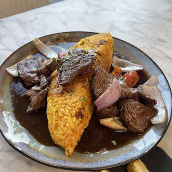 Mares Real Peruvian Cuisine - Tacu Tacu con Lomo Saltado - Peruvian Near Me - Orlando, Florida Mares Real Peruvian Cuisine - Tacu Tacu con Lomo Saltado - Peruvian Near Me - Orlando, Florida