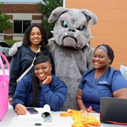 Beckfield College - Brutus the bulldog with nursing students