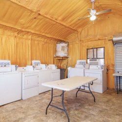 J's RV Park - Air-conditioned laundry room with a folding table