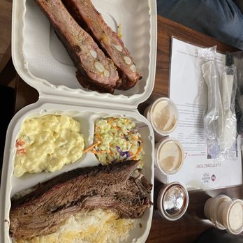 Art's BBQ - Rib and brisket combo with coleslaw and potato salad sides and rice with white sauce and bbq sauce on the side - Barbeque Near Me - Crescent City, California
