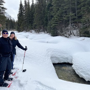 Packer Expeditions - Snowshoeing by the creek while it snowed in the Alaskan Tongass Forest. - Tours Near Me - Skagway, Alaska Packer Expeditions - Snowshoeing by the creek while it snowed in the Alaskan Tongass Forest. - Tours Near Me - Skagway, Alaska