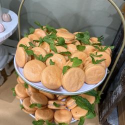 MaiCay Sweets Macarons - My "orange" macarons. So good. Looked great! Top was pistachio and bottom flavor was cookies and cream.