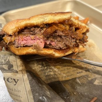 'Que - Outstanding 4.5" wide Short rib-brisket burger with more brisket, onion rings & cheddar on top. - Barbeque Near Me - Santa Barbara, California