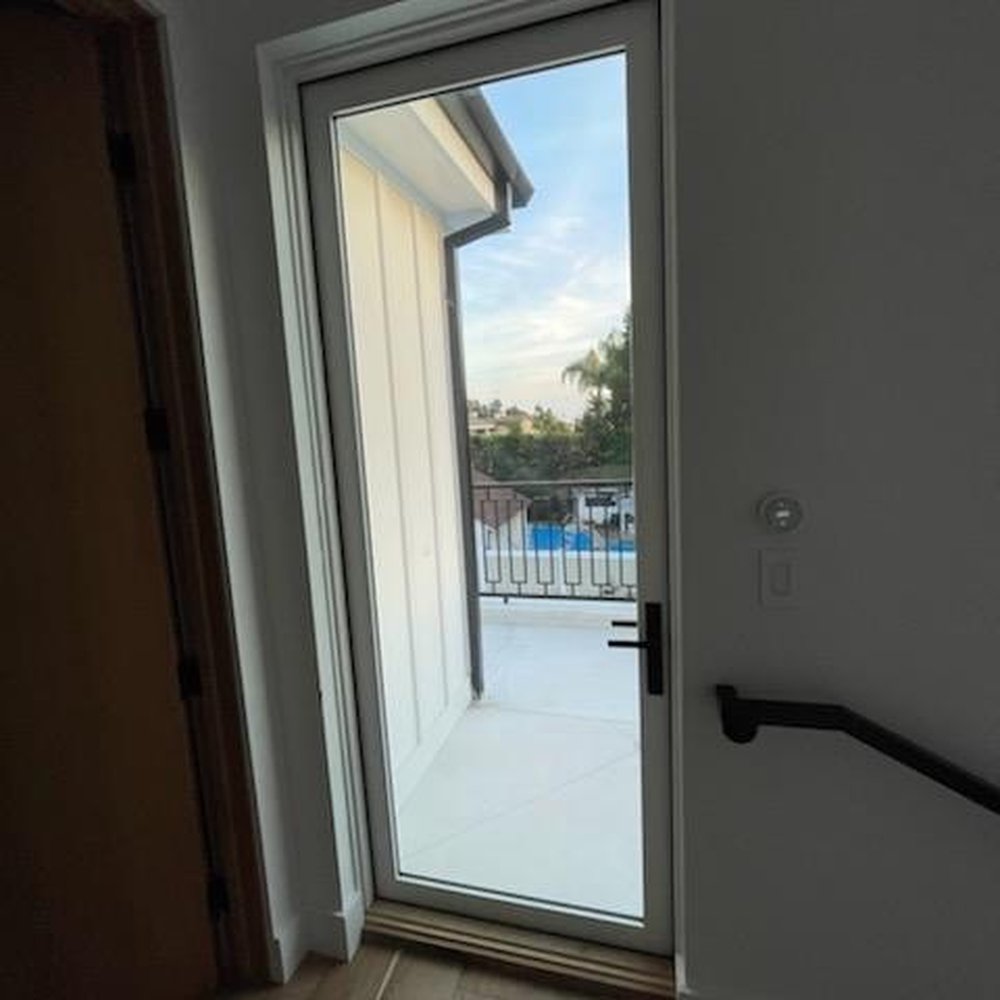 Ocean View Window Tint - Door which opens to balcony tinted slightly with anti glare to prevent sun damage. - Home Window Tinting Near Me Ocean View Window Tint - Door which opens to balcony tinted slightly with anti glare to prevent sun damage. - Home Window Tinting Near Me