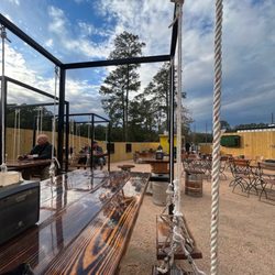 Lucky 19 Brewing Company - Picnic tables with individual swinging seats
