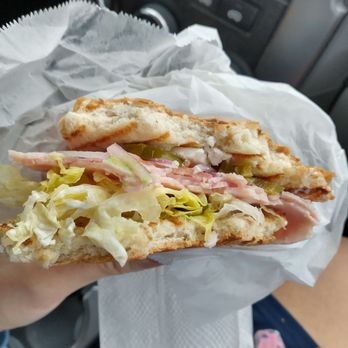 Panaderia La Purisima - a person holding a sandwich - Bakeries Near Me - West Sacramento, California Panaderia La Purisima - a person holding a sandwich - Bakeries Near Me - West Sacramento, California