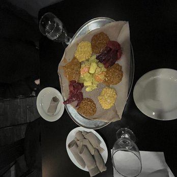 Awash Ethiopian Restaurant - a plate of food on a table - Ethiopian Near Me - New York, New York Awash Ethiopian Restaurant - a plate of food on a table - Ethiopian Near Me - New York, New York