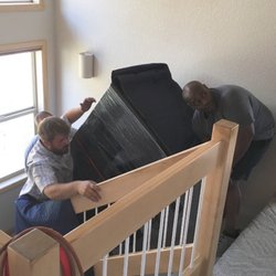 Just Solutions Moving - Moving a huge safe up some stairs.