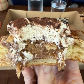 Relic Bakery & Kitchen - Tiramisu Nest (cross section, $10)-- caramel, coffee soaked lady fingers, creamy topping dusted with cacao powder - Bakeries Near Me - San Diego, California Relic Bakery & Kitchen - Tiramisu Nest (cross section, $10)-- caramel, coffee soaked lady fingers, creamy topping dusted with cacao powder - Bakeries Near Me - San Diego, California