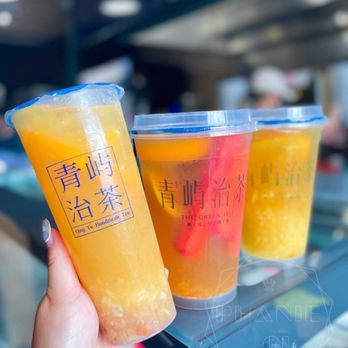 The Green Isle - a person holding two cups of orange juice - Juice Bars & Smoothies Near Me - Toronto, Ontario The Green Isle - a person holding two cups of orange juice - Juice Bars & Smoothies Near Me - Toronto, Ontario